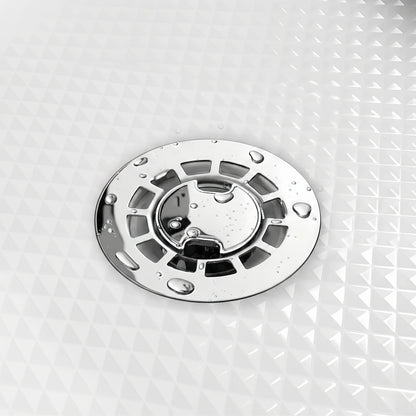 Close-up of Veloaura 2-inch round mirror-polished 304 stainless steel no caulk shower pan drain with water droplets on a white textured shower pan.
