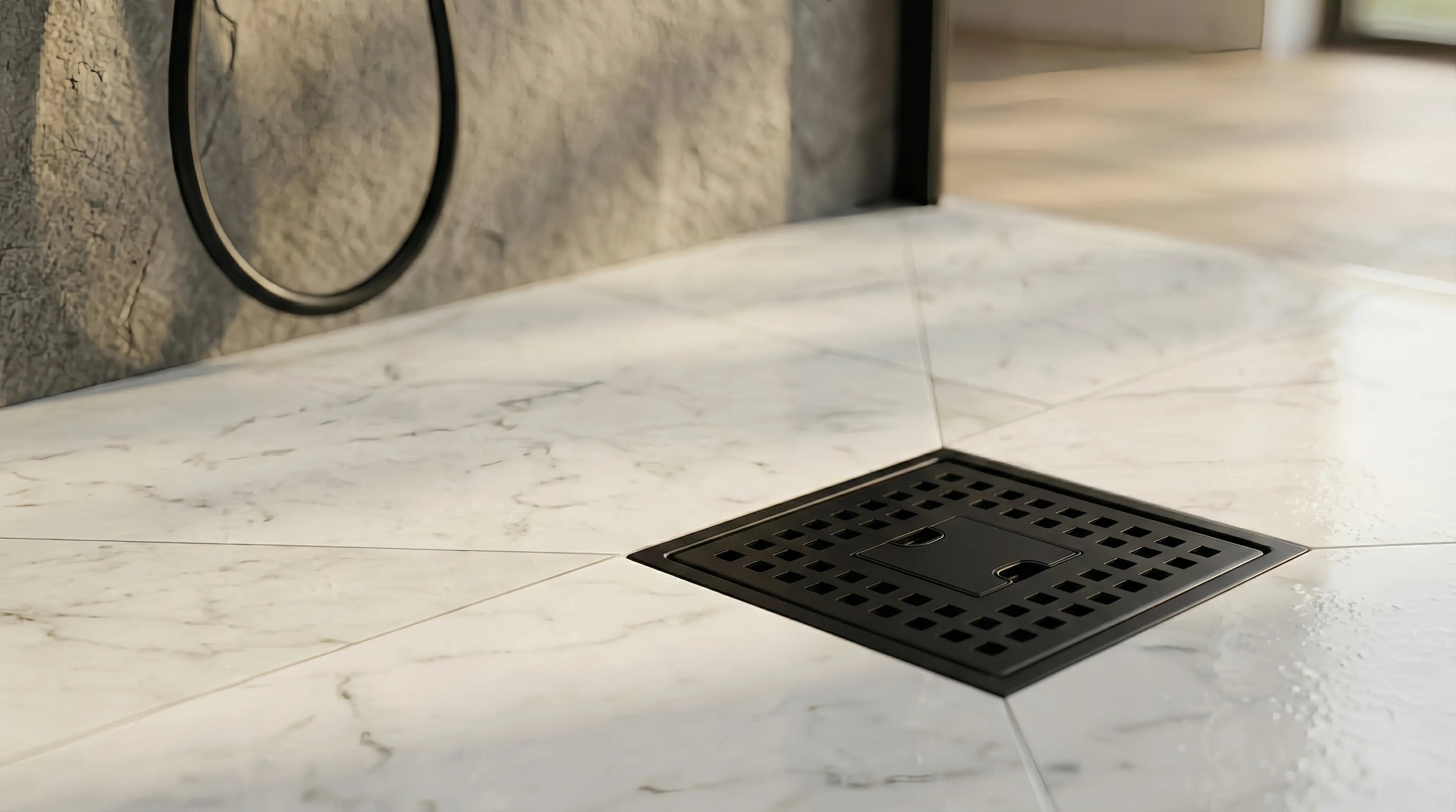 Veloaura shower drain before the lift-out hair catcher is removed