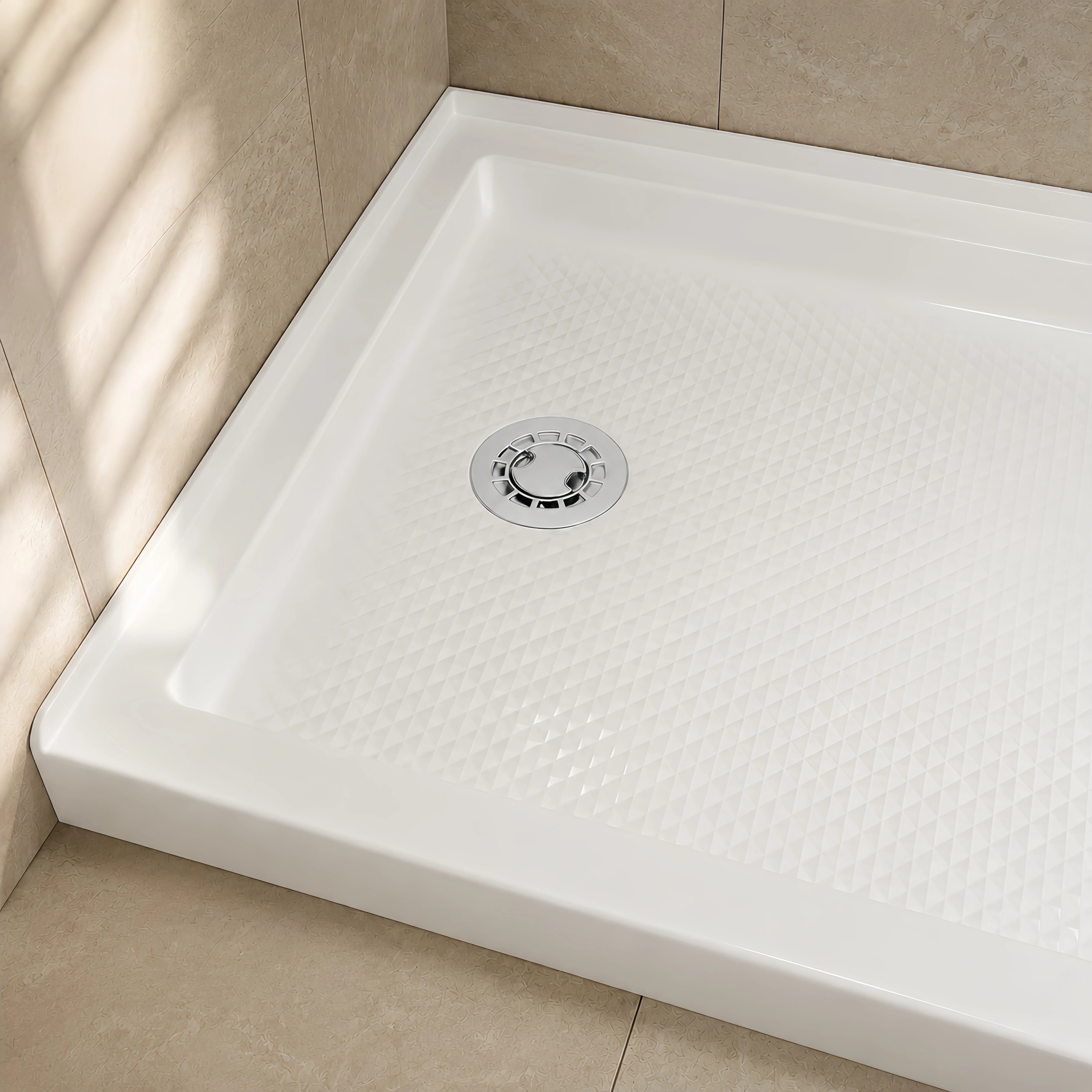 Veloaura 2 inch round no caulk shower pan drain installed in a white preformed shower pan