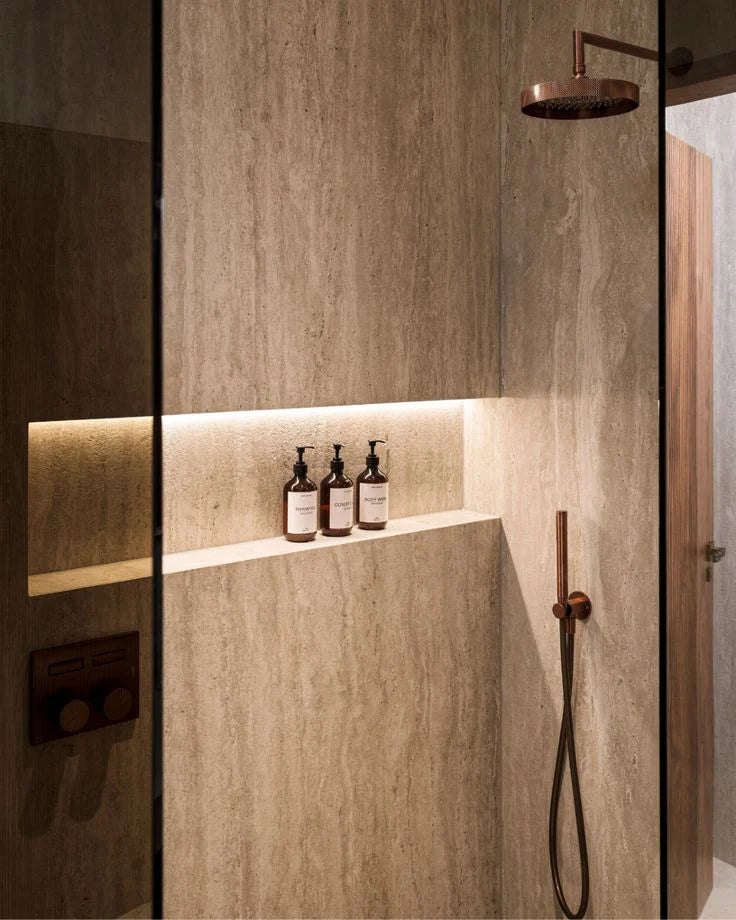 Travertine shower design with refined bathroom details and premium fixtures